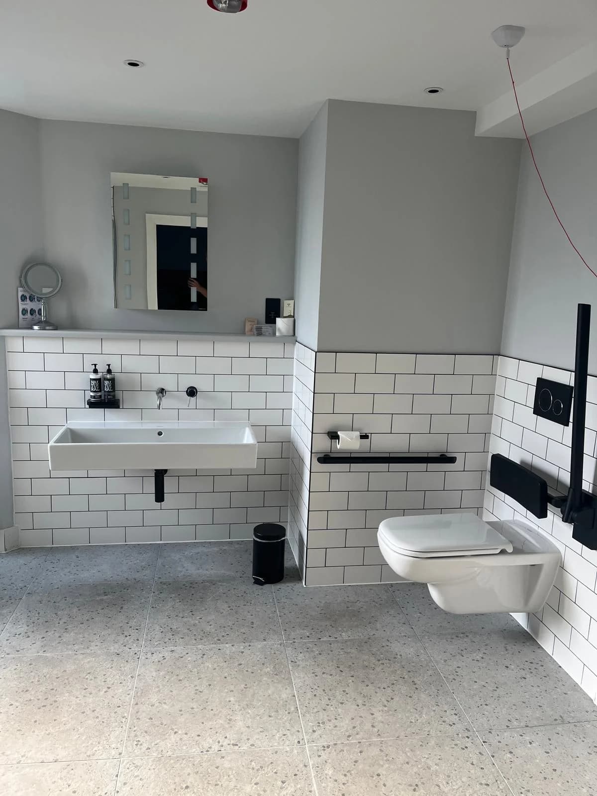 Bathroom sink and toilet after plumbing maintenance work