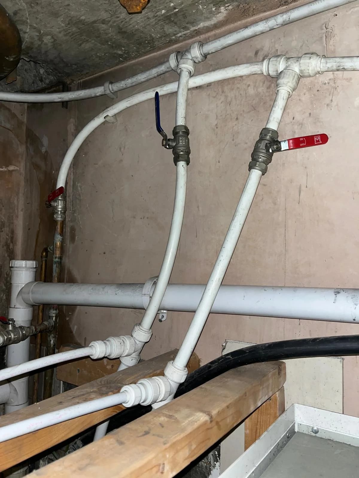 Exposed pipework before plumbing repair and maintenance