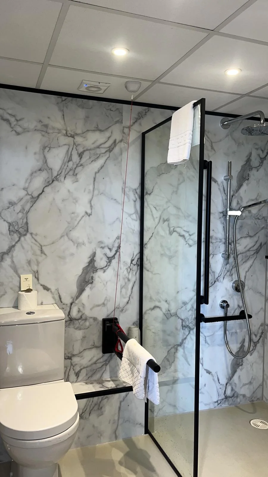 Completed bathroom refurbishment with new shower, basin and fittings