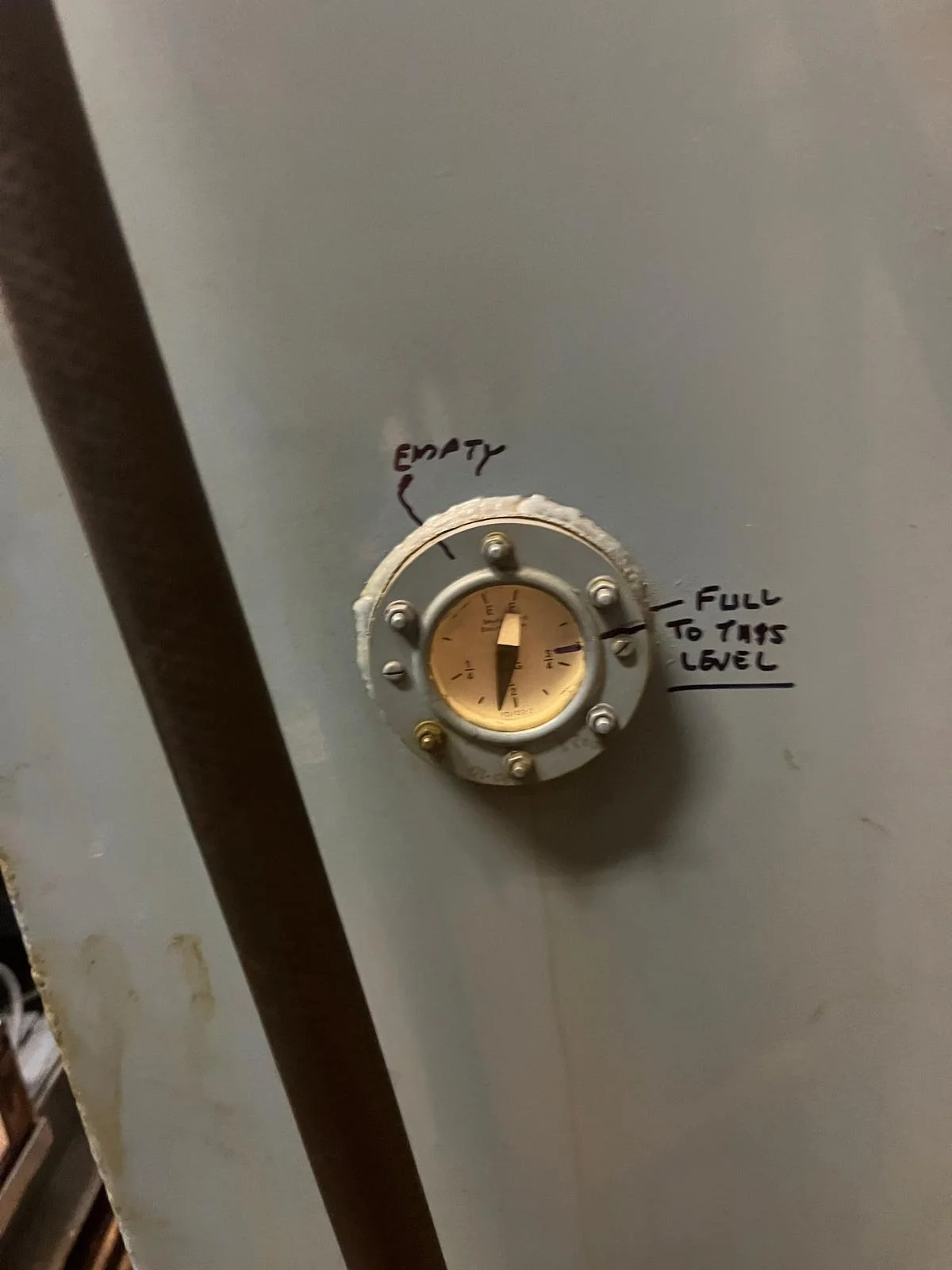Boiler information plate inspected during plumbing assessment