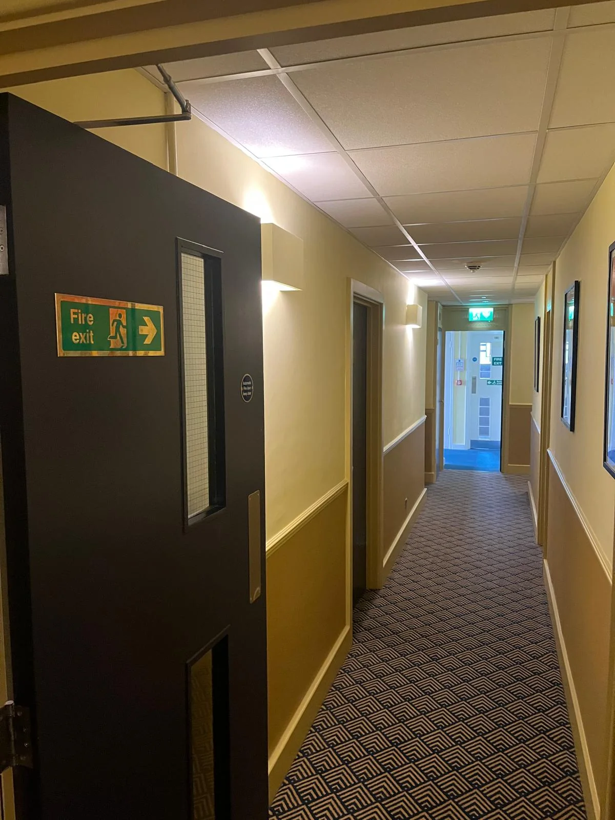 Fire exit door and closer inspected during remedial work