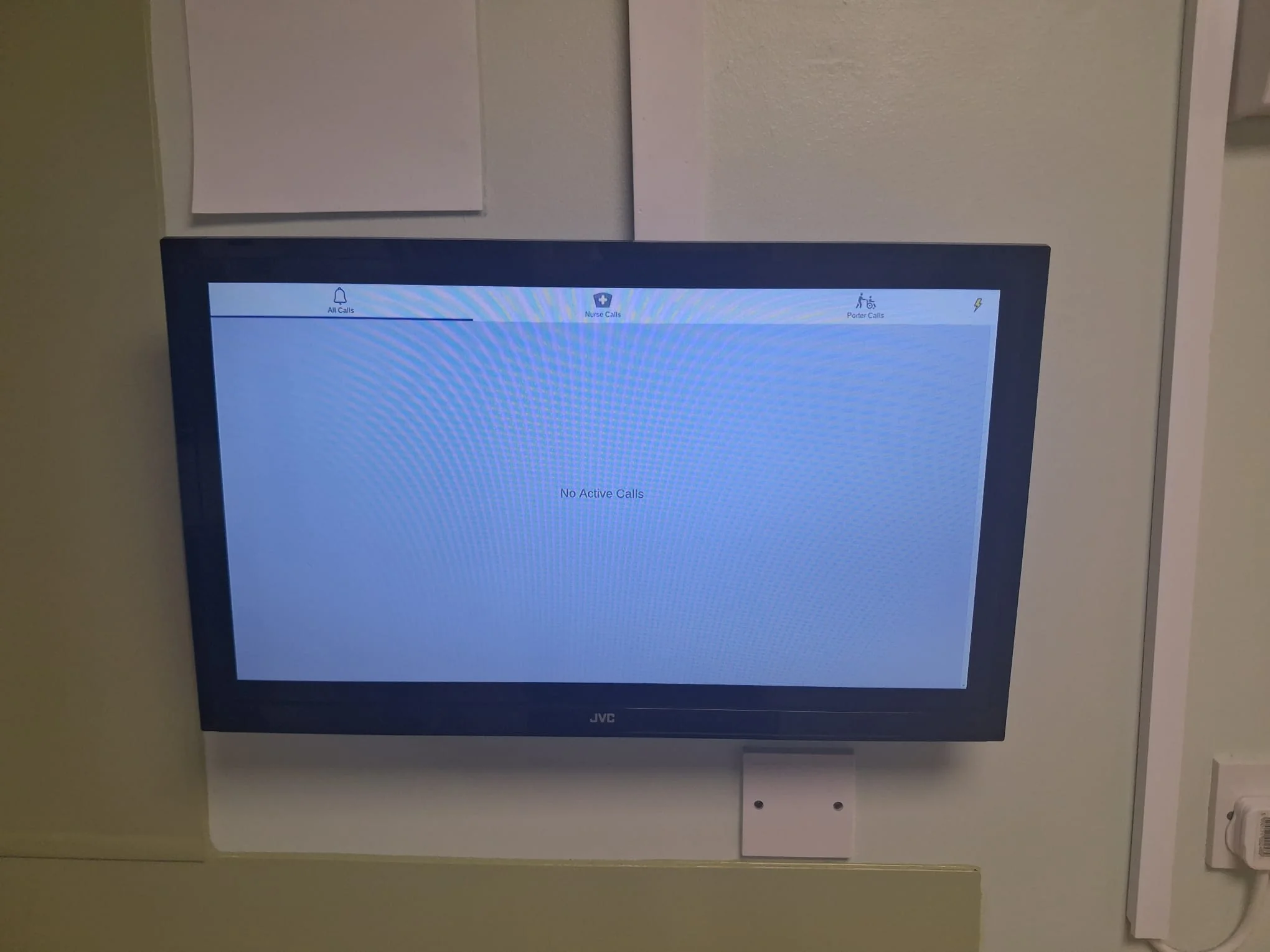 Wall-mounted television displaying a fault screen during inspection