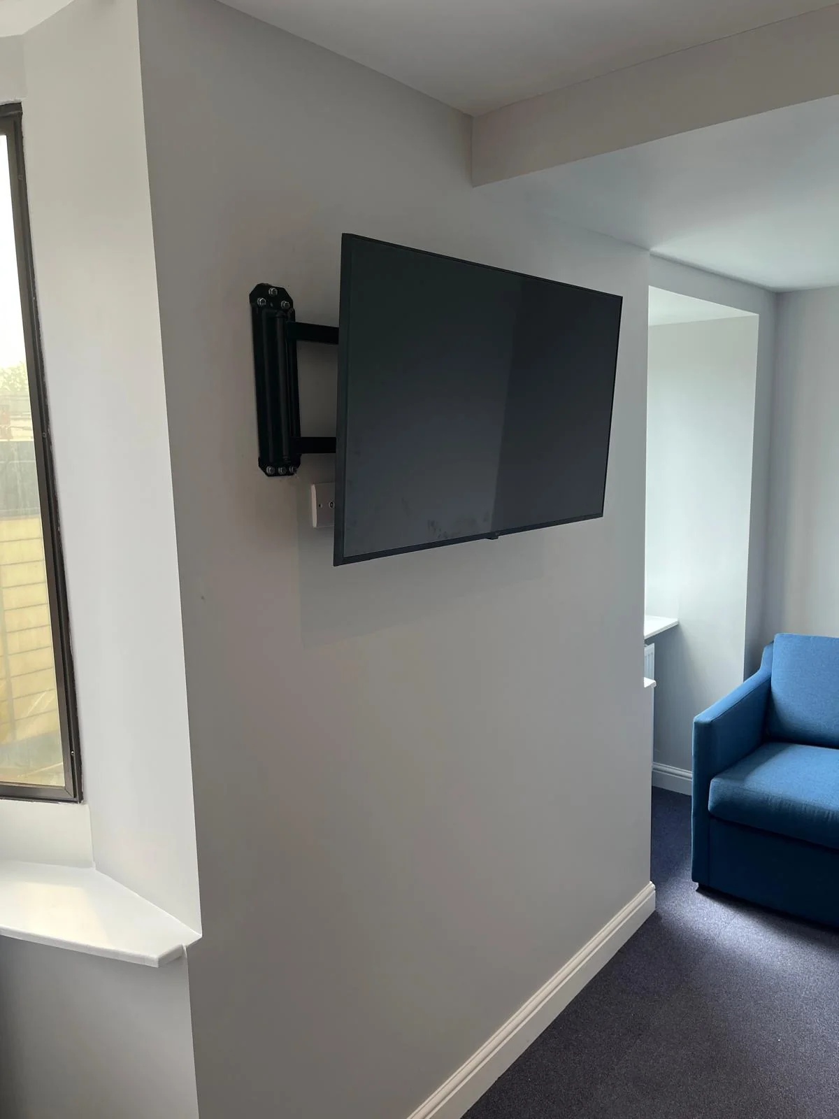 Television mounted on wall after installation
