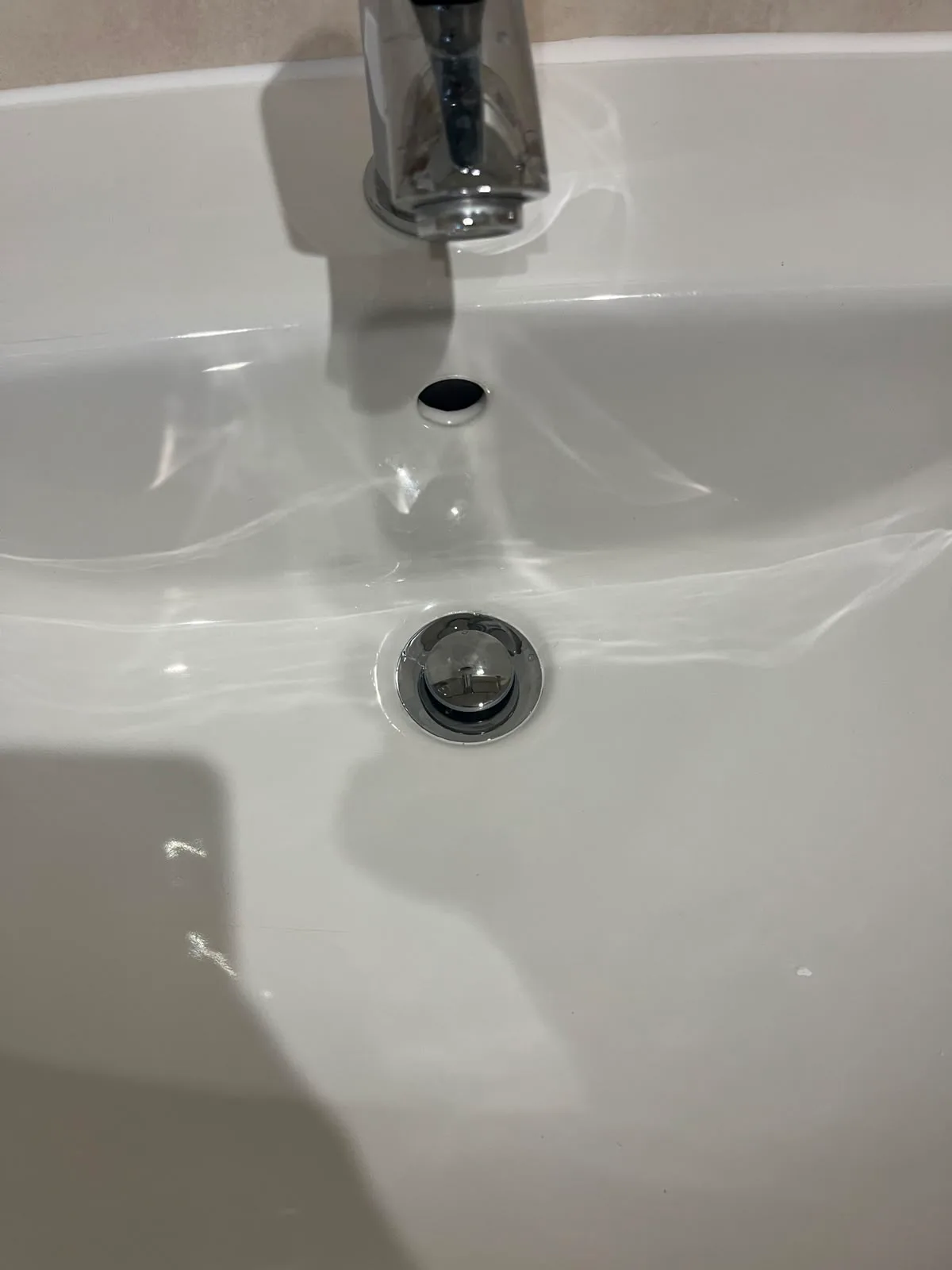 Faulty basin waste close-up in Bexleyheath Close-up of bathroom basin after waste replacement in Bexleyheath