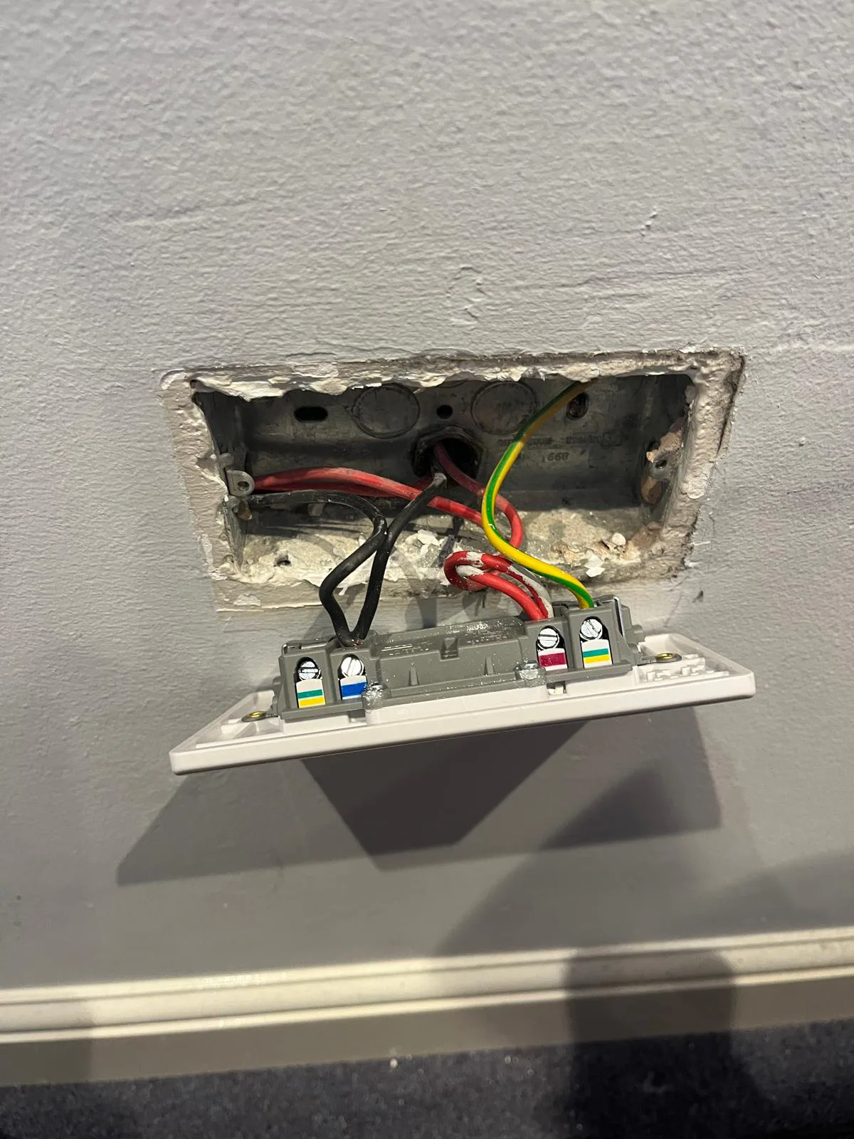 Existing Double Socket Connections Inspected Existing socket wiring and terminal connections exposed during replacement