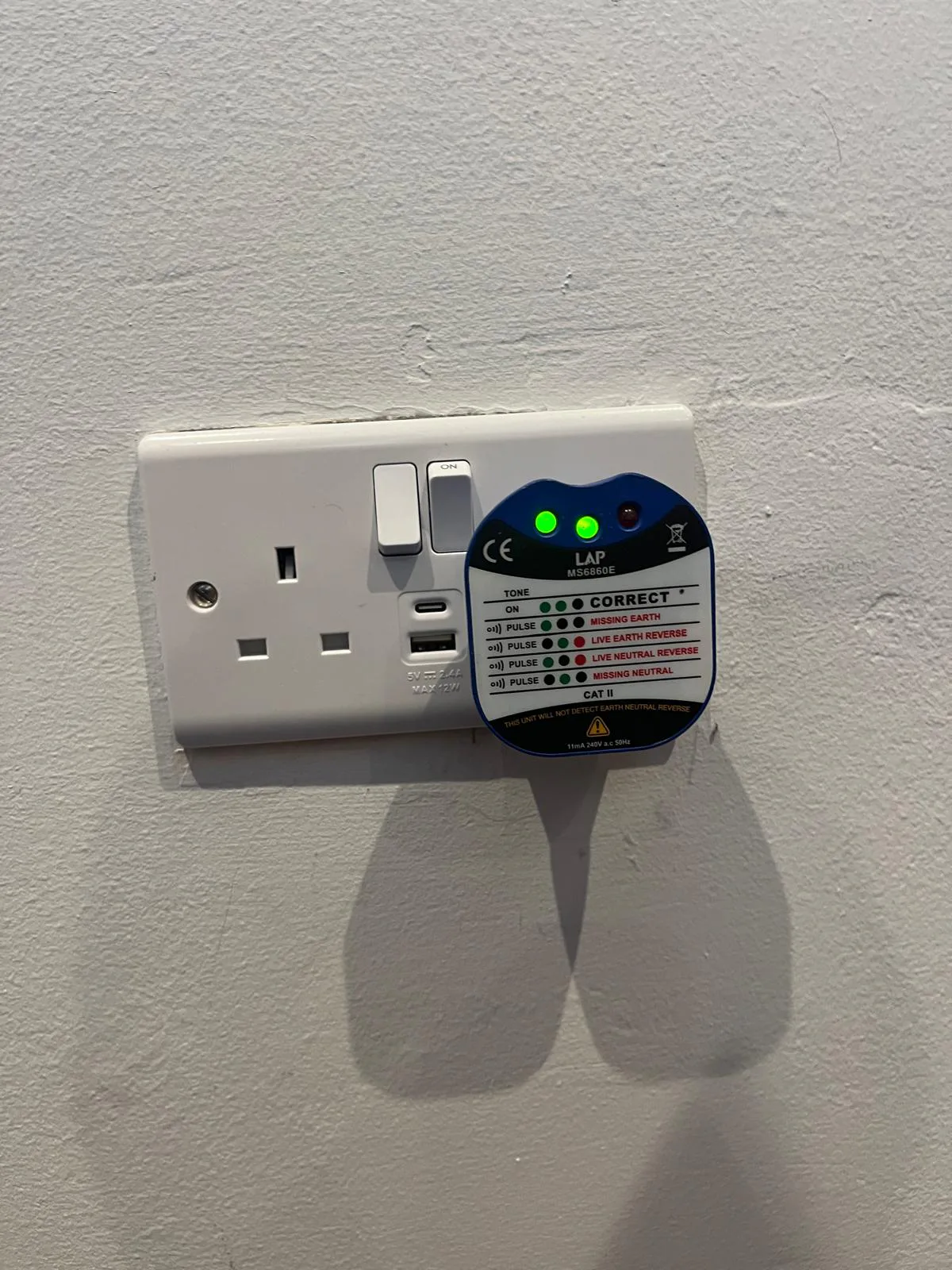 Double Socket Tested After Installation Electrical socket tester checking new USB and USB-C double socket