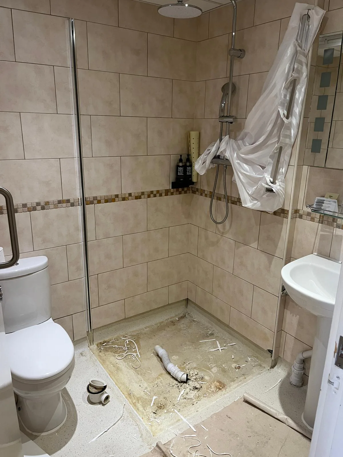 Shower waste pipework exposed during tray replacement